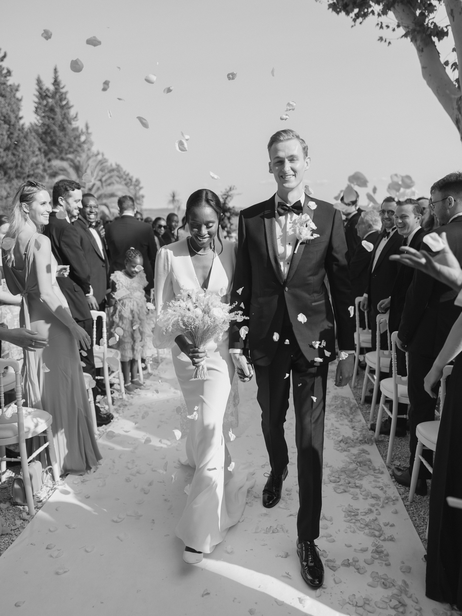 Couple picture in black & white exiting the ceremony at Chateau de la Roque Forcade